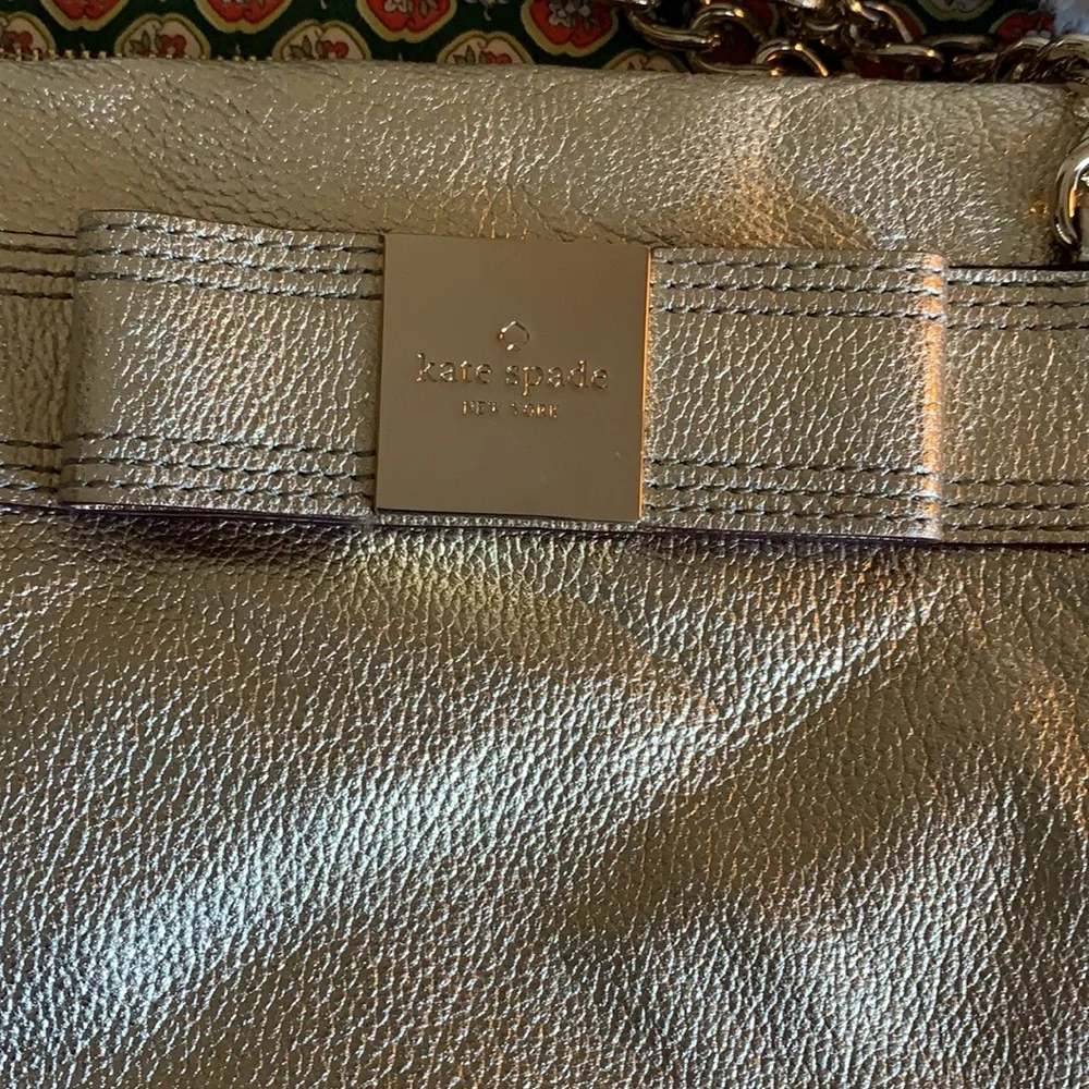 Kate spade gold‎ metallic bow purse. Never used. Retail 298